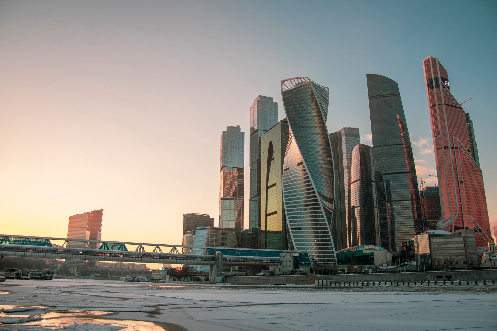 Beautiful view of Moscow city skyscrapers at sunset during winter, showcasing modern architecture.