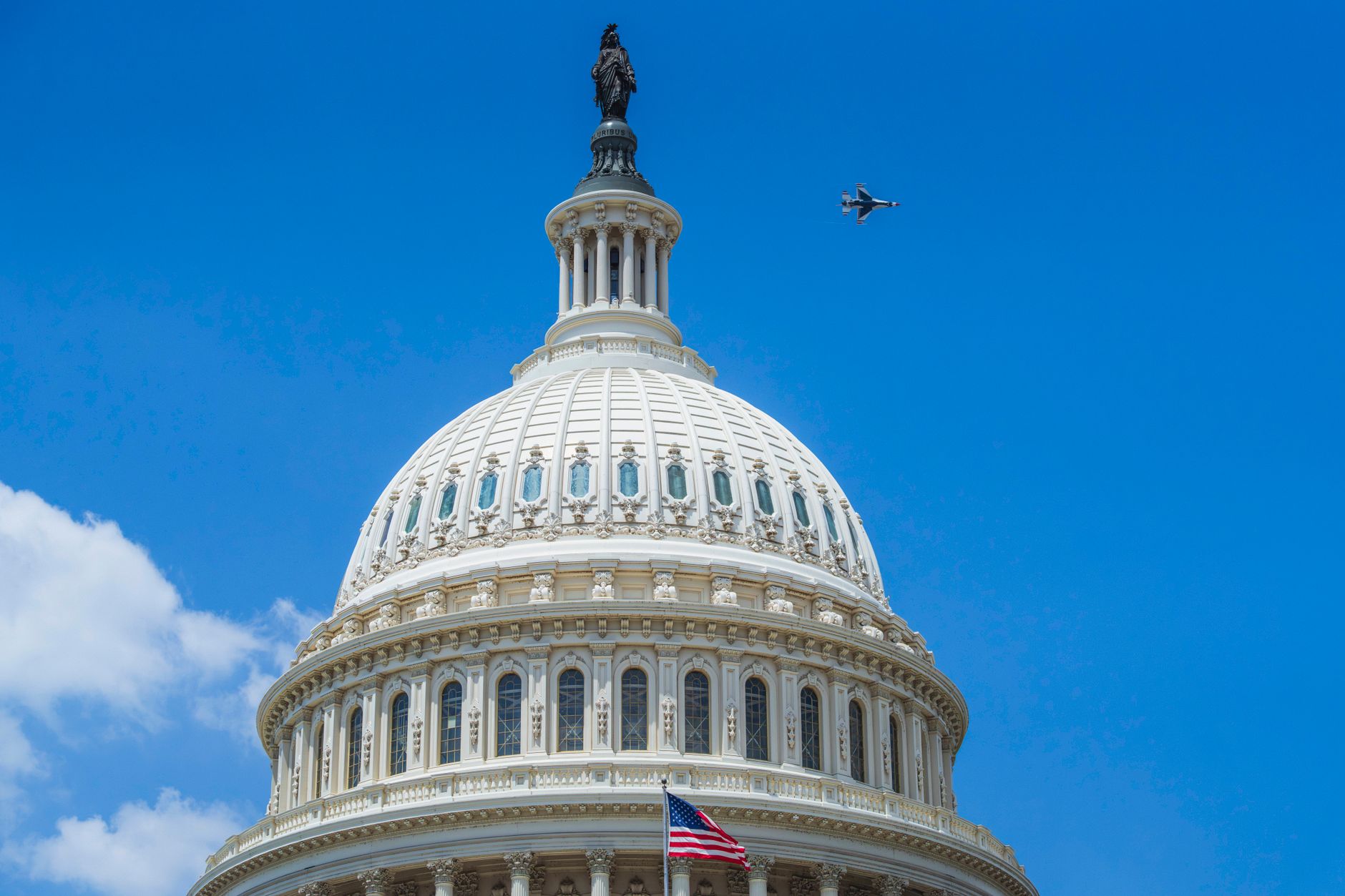 Dome of the U.S. Capitol against a blue sky