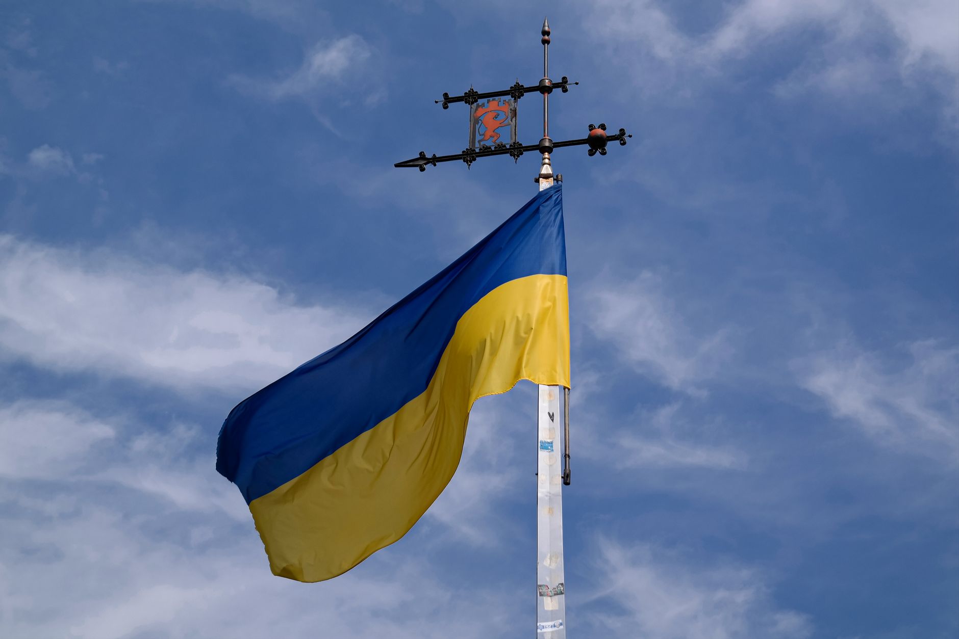 Ukrainian flag flying against a blue sky